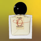 Digital rendering of Chronotope Perfume’s Buen Camino Extrait de Parfum bottle with a mirrored gold label signed by the perfumer in brown ink and marked with a handwritten number indicating its limited release, containing pale golden perfume, and set against a matching Amberlit Gold background.
