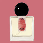 Digital rendering of Chronotope Perfume’s Silueta Eau de Parfum bottle with a white label stamped with the perfumer’s thumbprint in Exile Red, containing pale yellow rose-tinted perfume, and set against a matching Exile Red background.