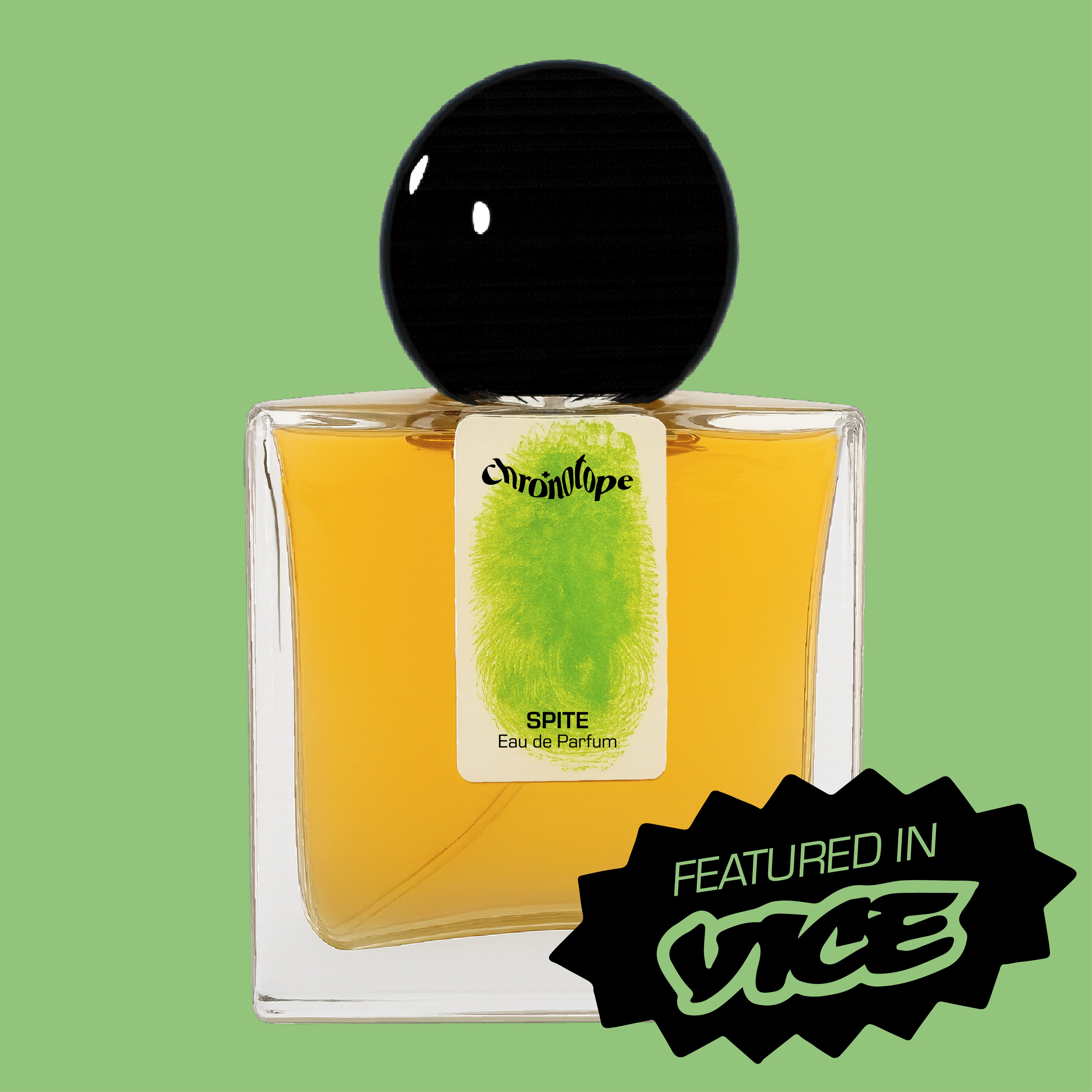 Digital rendering of Chronotope Perfume’s Spite Eau de Parfum bottle with a white label stamped with the perfumer’s thumbprint in Sprouted Green, containing green-amber perfume, and set against a matching Sprouted Green background with a badge noting press coverage in Vice News.